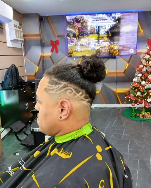 Fade haircut with a detailed hair design