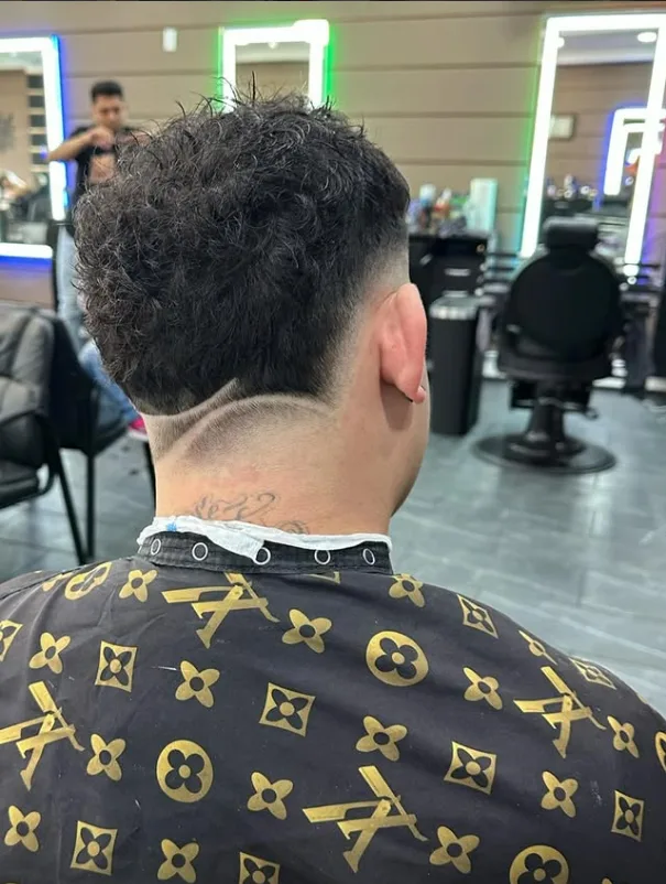 Neckline haircut design with clean shaved detail